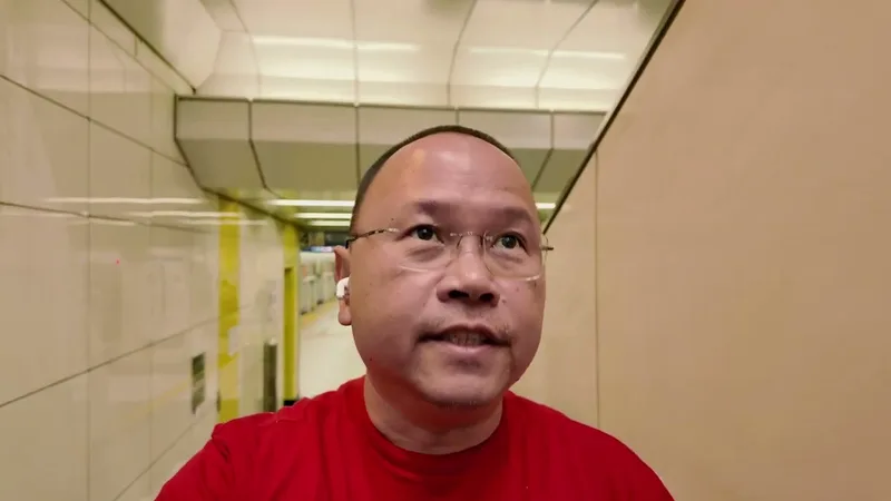 Selfie in a bright Tokyo subway tunnel walkway heading toward Tokyo Skytree, Japan