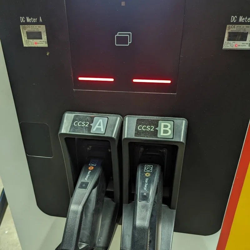 Shell Recharge DC fast charger with CCS2 connectors at a charging station in the Philippines at night