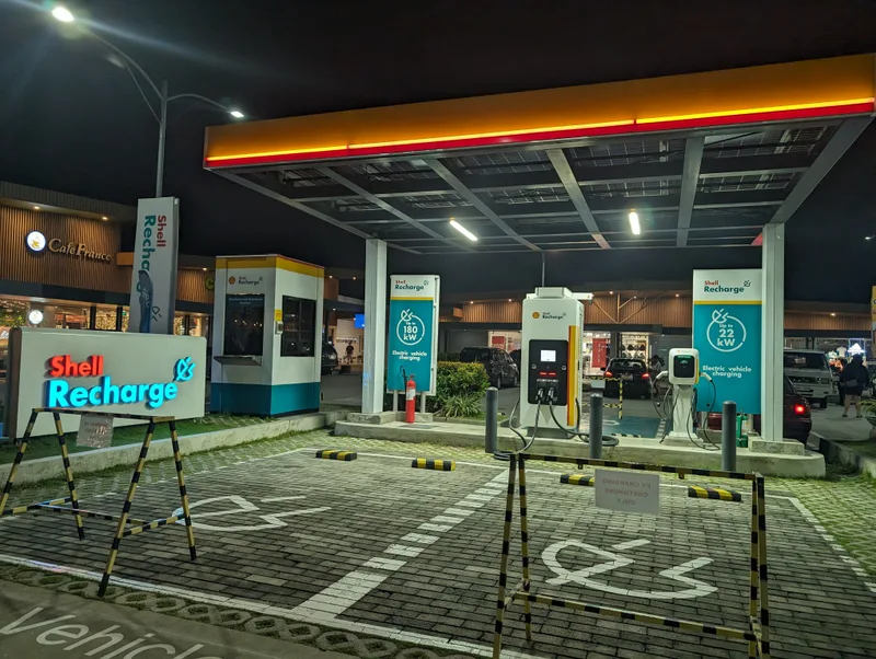Shell Recharge EV charging station wide view at night on SLEX, South Luzon Expressway, Philippines