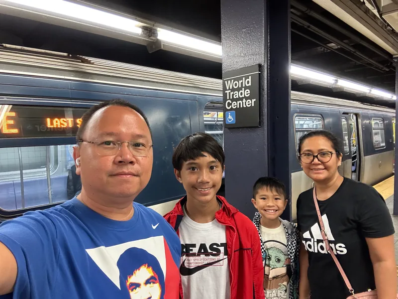 Family selfie on NYC subway platform at World Trade Center station